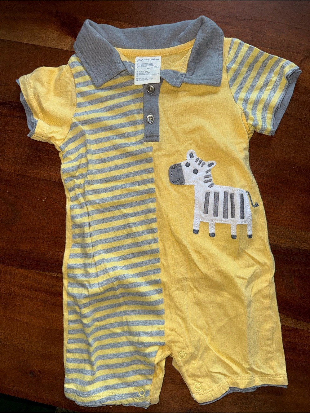 First Impressions Yellow and Gray Zebra Polo Romper